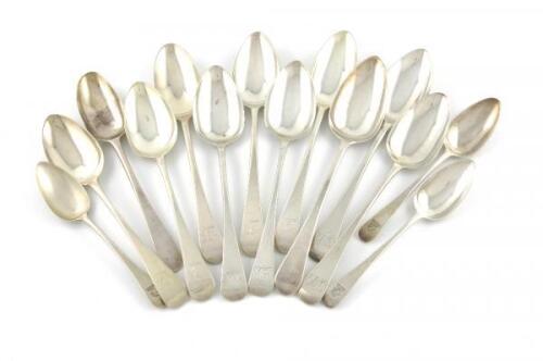A mixed lot of antique silver Old English pattern flatware, various dates and makers, comprising: eleven tablespoons, and three dessert spoons, some with crests and initials, approx. weight 25oz. (14)
