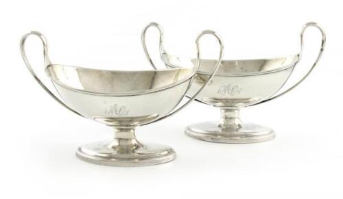 A pair of George III silver salt cellars, by Richard Morton, Sheffield 1790, oval form, loop scroll handles, on raised oval bases, length 13.4cm, approx. weight 5.2oz. (2)