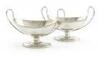 A pair of George III silver salt cellars, by Richard Morton, Sheffield 1790, oval form, loop scroll handles, on raised oval bases, length 13.4cm, approx. weight 5.2oz. (2)