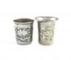 A 19th century silver and niello work beaker, assay master Andrey Kovalskiy, Moscow 1855, tapering circular form, with a townscape scene and foliate decoration, height 6.2cm, plus an electroplated beaker. (2)