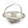 A silver swing-handled basket, by Poston Products Ltd, Sheffield 1962, circular form, pierced and engraved with trailing vine decoration, on three pierced bracket feet, diameter 28cm, approx. weight 27oz.