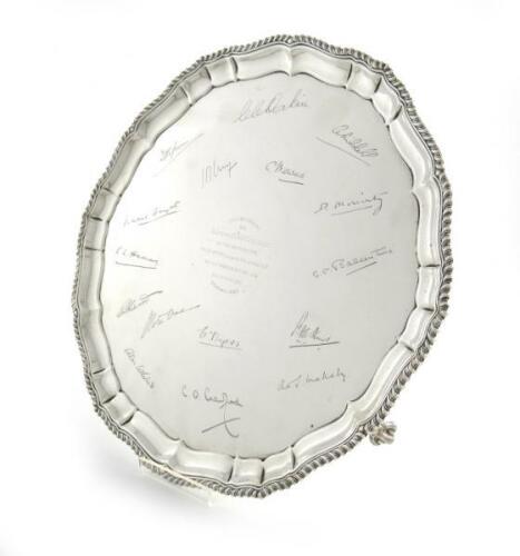 A presentation silver salver, by Henry Atkins, Sheffield 1931, circular form, gadroon border, on three claw and ball feet, the centre inscribed 'Presented to Captain F. C. McCaughey, by The Officers 1st BN. 2ND Punjab Regiment on the occasion of his marri
