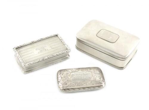 A small collection of three antique silver snuff boxes, comprising: one by Edward Smith, Birmingham 1853, slender rectangular form, engraved foliate scroll decoration, with a presentation inscription, length 6.3cm, plus a George IV one by Thomas Shaw, Bir