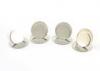 A set of four silver menu card holders, by Richard Woodman Burbridge for Harrods, London 1935, plain circular disc form, on circular bases, approx. weight 3oz. (4)