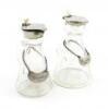 Two similar silver-mounted whisky tots, one by Levi and Salaman, Birmingham 1923, one by Hukin and Heath, Birmingham 1912, tapering conical form, plain mounts, with two whisky labels. (4)