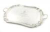 An Edwardian silver two-handled tray, by The Goldsmiths and Silversmiths Company, London 1908, rectangular form, canted corners, moulded border, inscribed with a regiment badge and 'Presented to the Officers P.W.O.R.R Wiltshire Yeomanry by The Hon. Lt. C