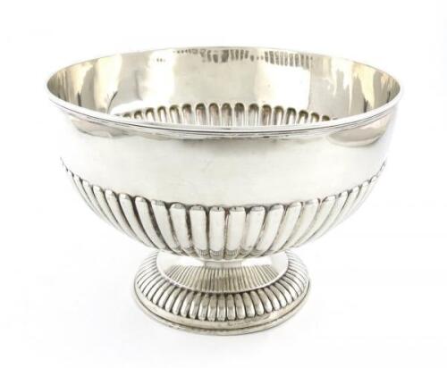 An Edwardian silver rose bowl, by William Hutton and Sons, London 1946, circular form, part-fluted decoration, on a raised circular fluted foot, diameter 23.4cm, approx. weight 19.8oz.