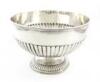 An Edwardian silver rose bowl, by William Hutton and Sons, London 1946, circular form, part-fluted decoration, on a raised circular fluted foot, diameter 23.4cm, approx. weight 19.8oz.