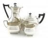 A four-piece silver tea set, by James Dixon and Sons, Sheffield 1932/33, oblong bellied form, scroll handles, on four ball feet, length handle to spout 28cm, approx. weight 58oz. (4)