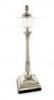 An Edwardian silver oil lamp, by Mappin and Webb, Sheffield 1902, Corinthian column form, on a stepped raised square base with foliate corners and a gadroon border, with a circular glass oil holder, later drilled for electricity, on a wooden base, height 