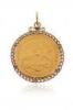 A gold US $20 coin pendant, in gold curb-link surround, 38g