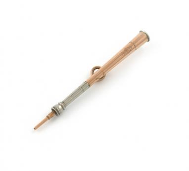 A Victorian novelty silver and gold pencil, by Ortner and Houle, also marked with a registration lozenge for 1875, modelled a coaching or hunting horn, tapering form, with a ring attachment, length 7cm Provenance: The KB Collection of Pencils. Illustrate