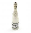 A Victorian novelty silver and enamel pencil, unmarked, modelled as champagne bottle, enamelled label, with a ring attachment, length 6.2cm. Provenance: The KB Collection of Pencils. Illustrated in Bull, K., The KB Collection of Pencils, private publicat