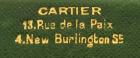 A French gold and enamel pencil, by Cartier, Paris, feather quill form, with grey enamel decoration and a gold and white enamel bead border, with a moonstone slider, in a fitted Cartier case, the underside with 'Cartier 13, Rue de la Paix, and 4, Burlingt - 3
