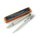 A Mordan Centenary silver pencil, London 1915, also marked patent, the finial with a pencil reserve, length 11cm, plus a Mordan Centennial silver pencil, London 1921, also marked 'S. Mordan and Co., Pat. App. For "Centennial" Rd. 683188', with a cardboa